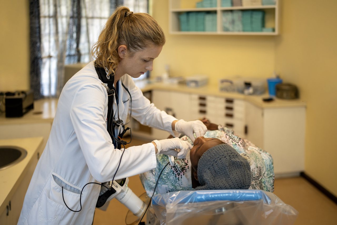 Dental clinician caring for a patient at Malamulo
